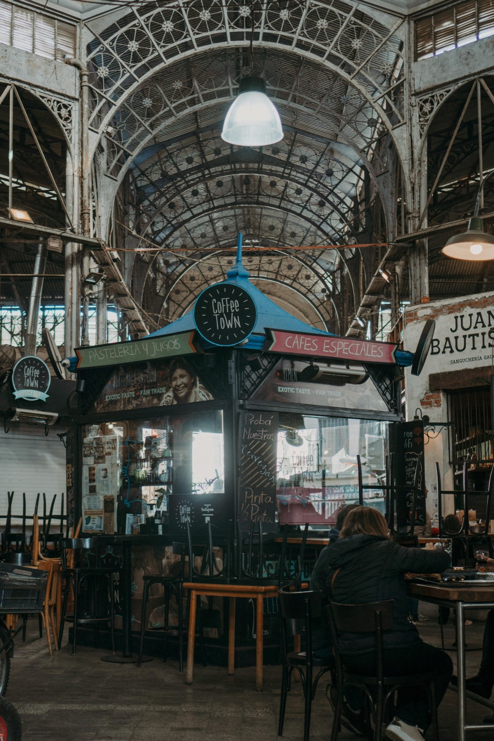 Inside the San Telmo Market, a historic wrought-iron market hall in Buenos Aires