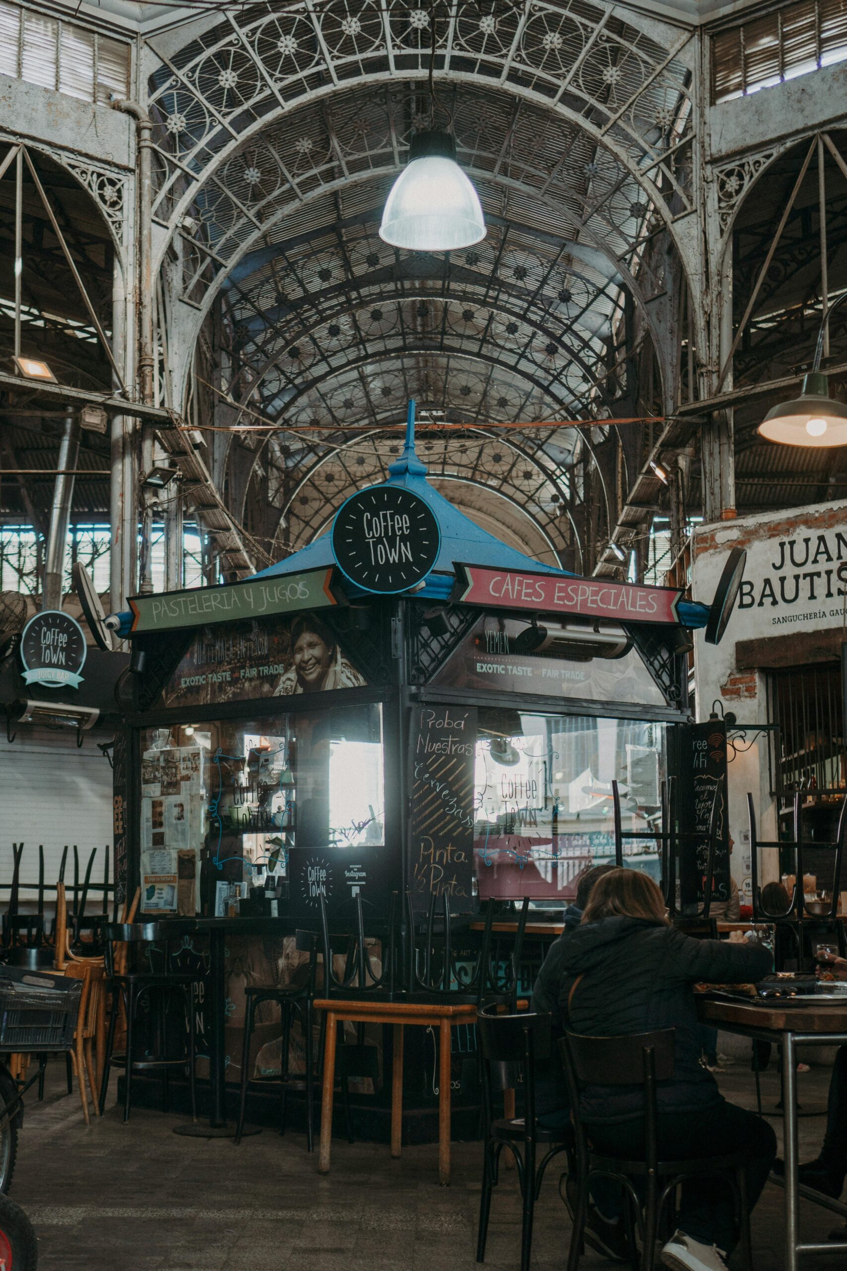 Mercado de San Telmo interior with antique stalls and cast iron architecture
