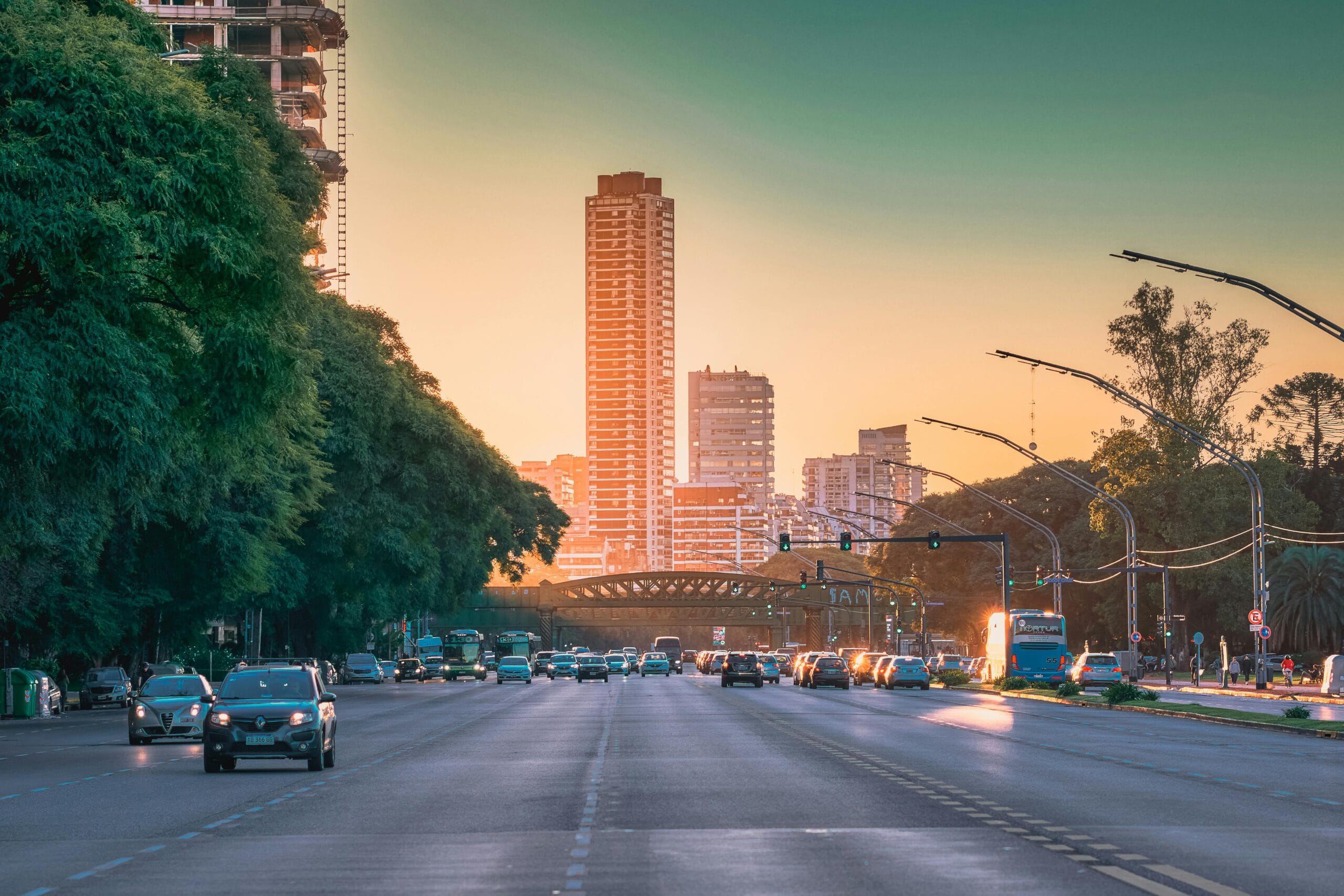Avenida del Libertador at sunset, tree lined, heading toward the Palermo towers