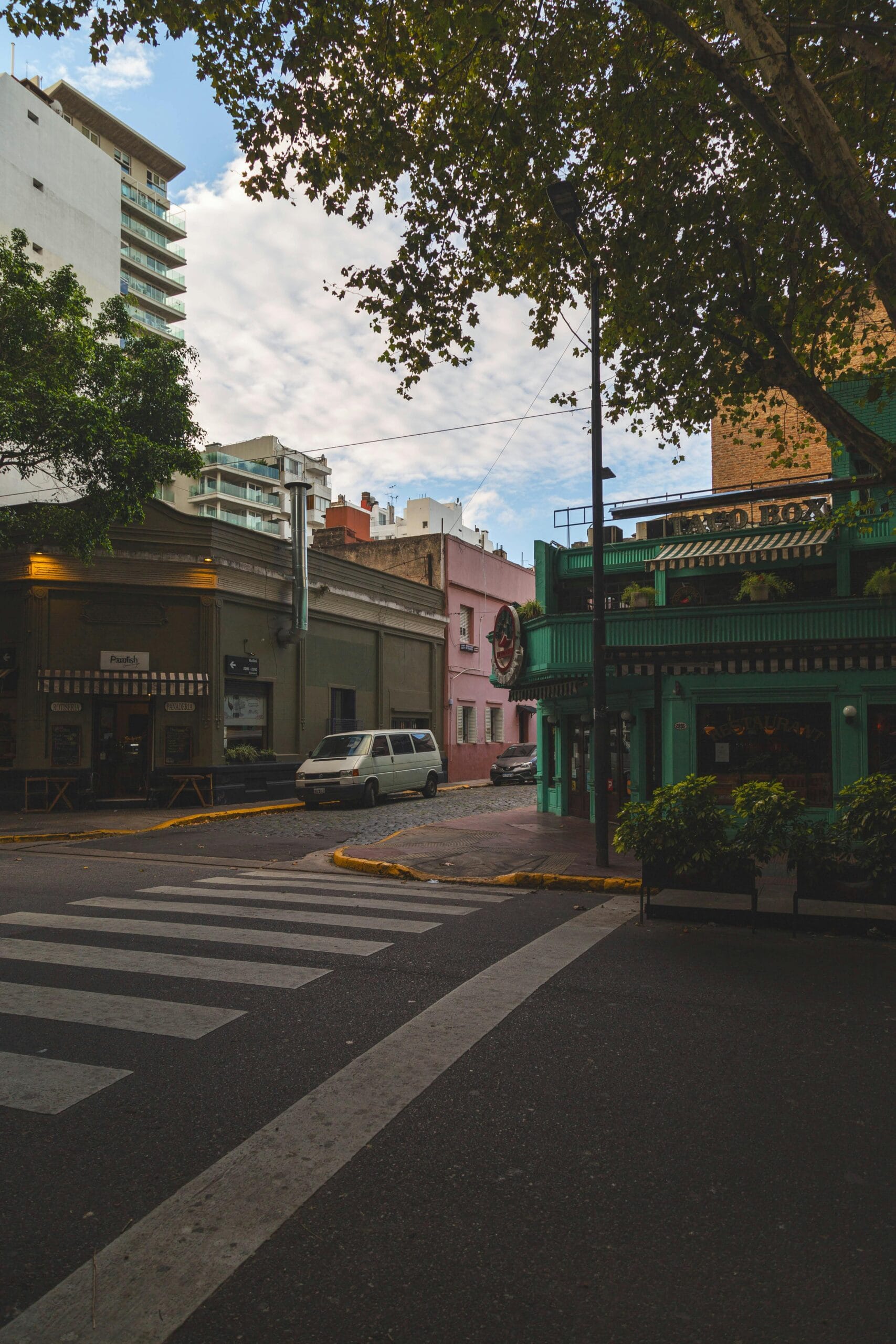A quiet street in Recoleta with trees and elegant apartment buildings