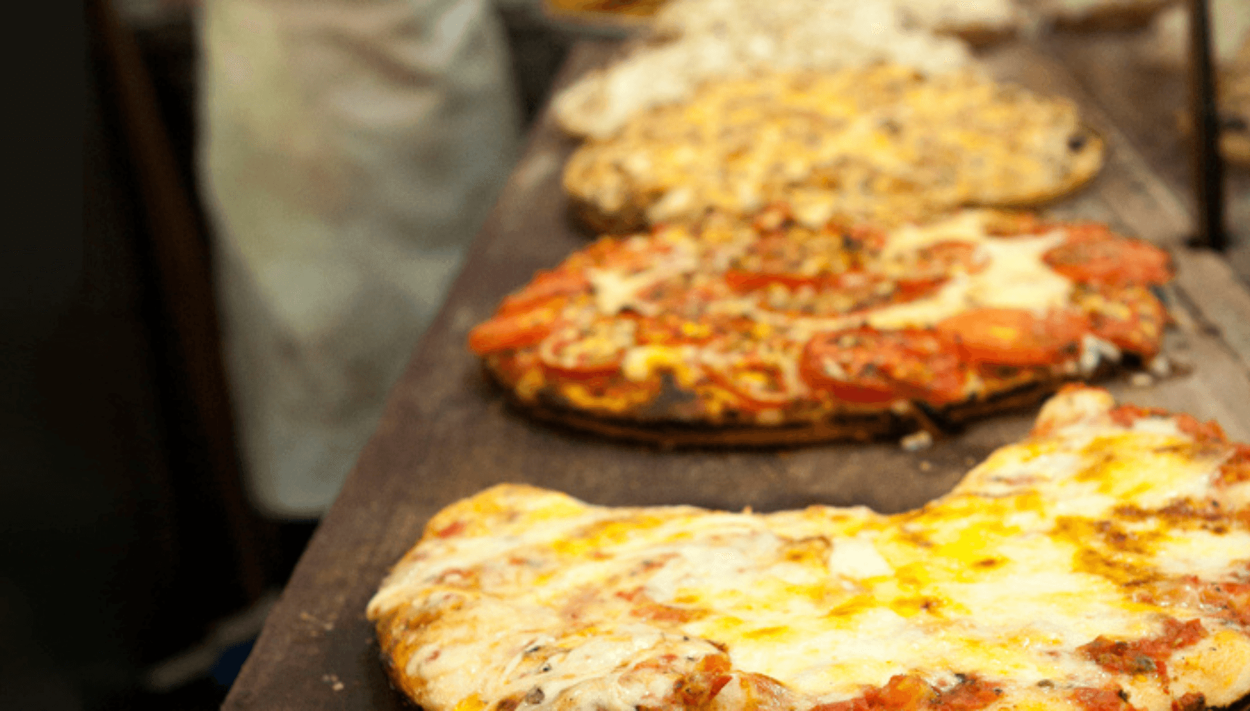 Pizza on a wooden board in a Buenos Aires pizzeria