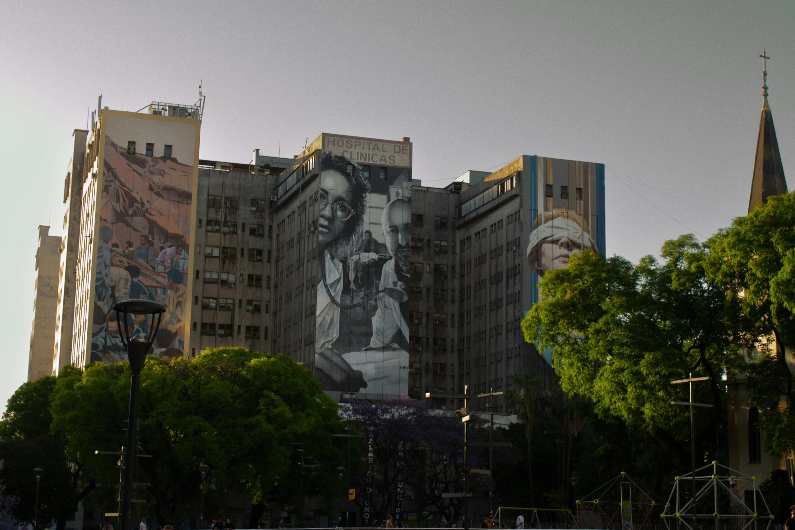 A large painted mural covering the side of an apartment building