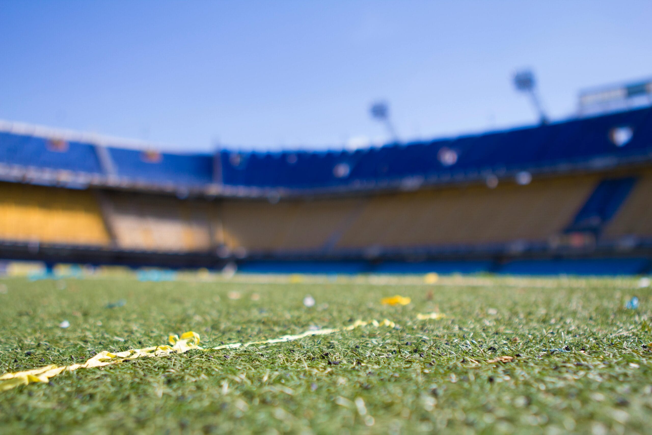 The pitch and floodlights of a football stadium in Buenos Aires before kick-off